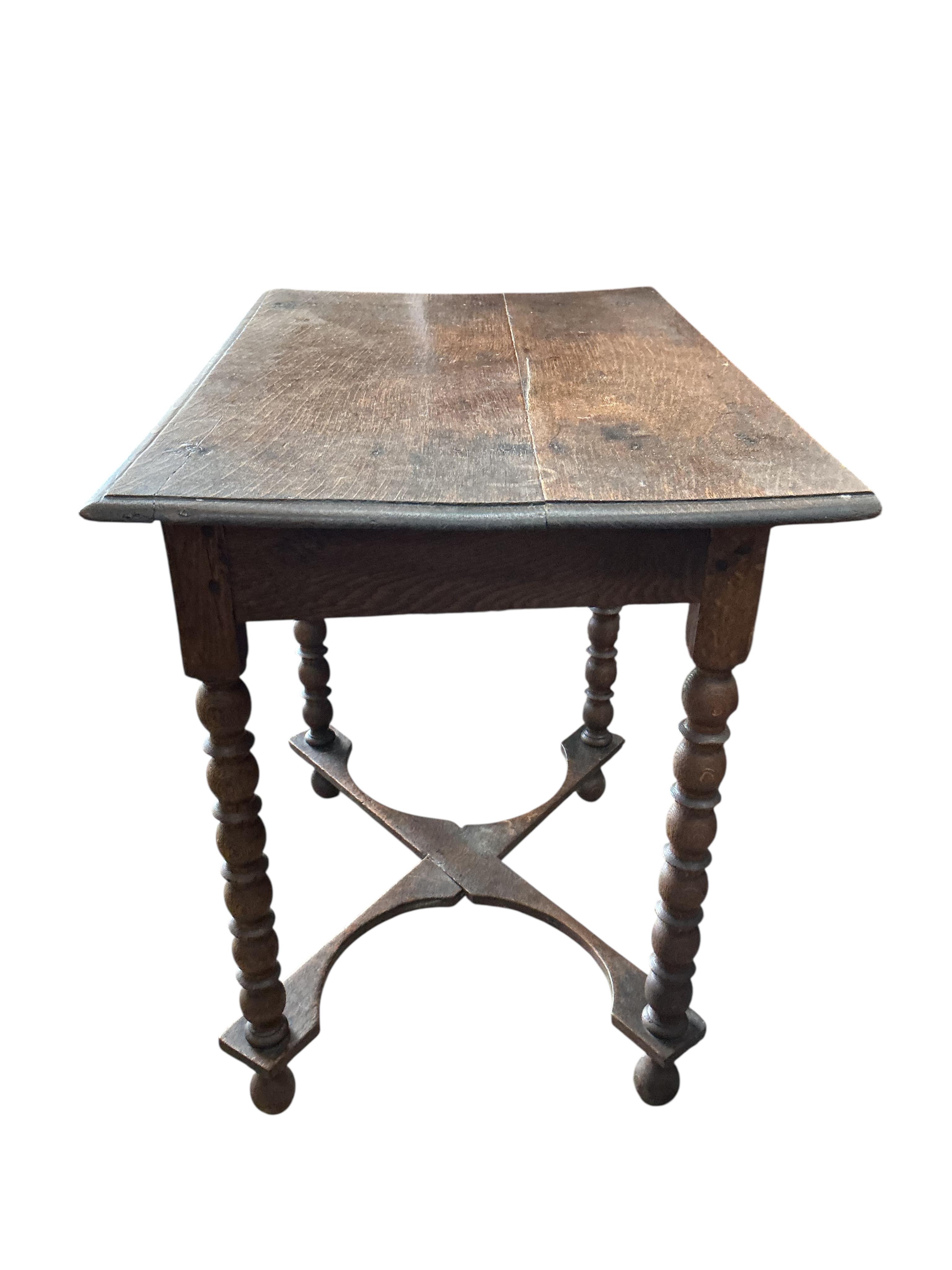 An 18th century rectangular oak bobbin leg side table, width 81cm, depth 50cm, height 71cm